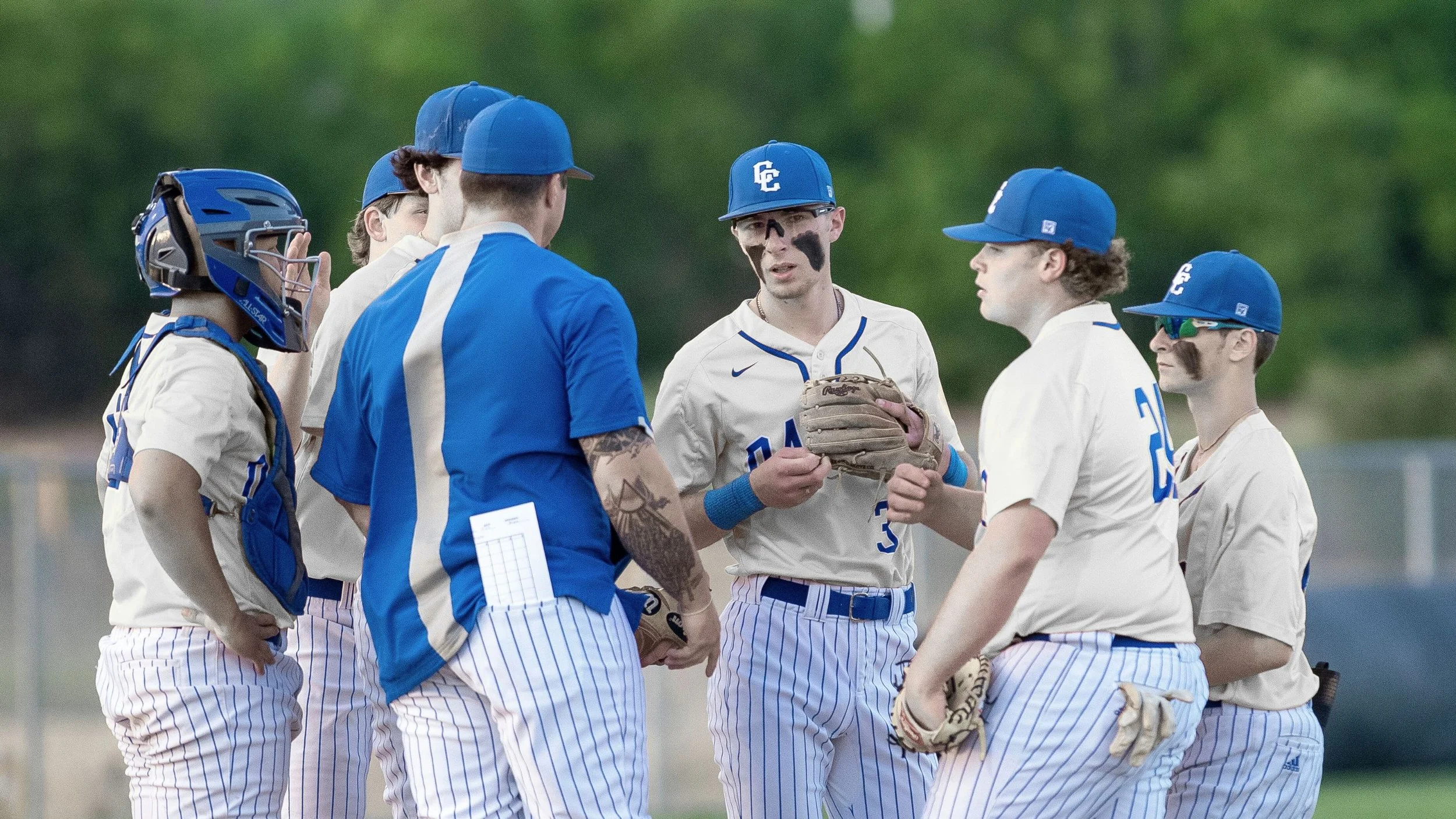 Baseball team discussing a play on the field