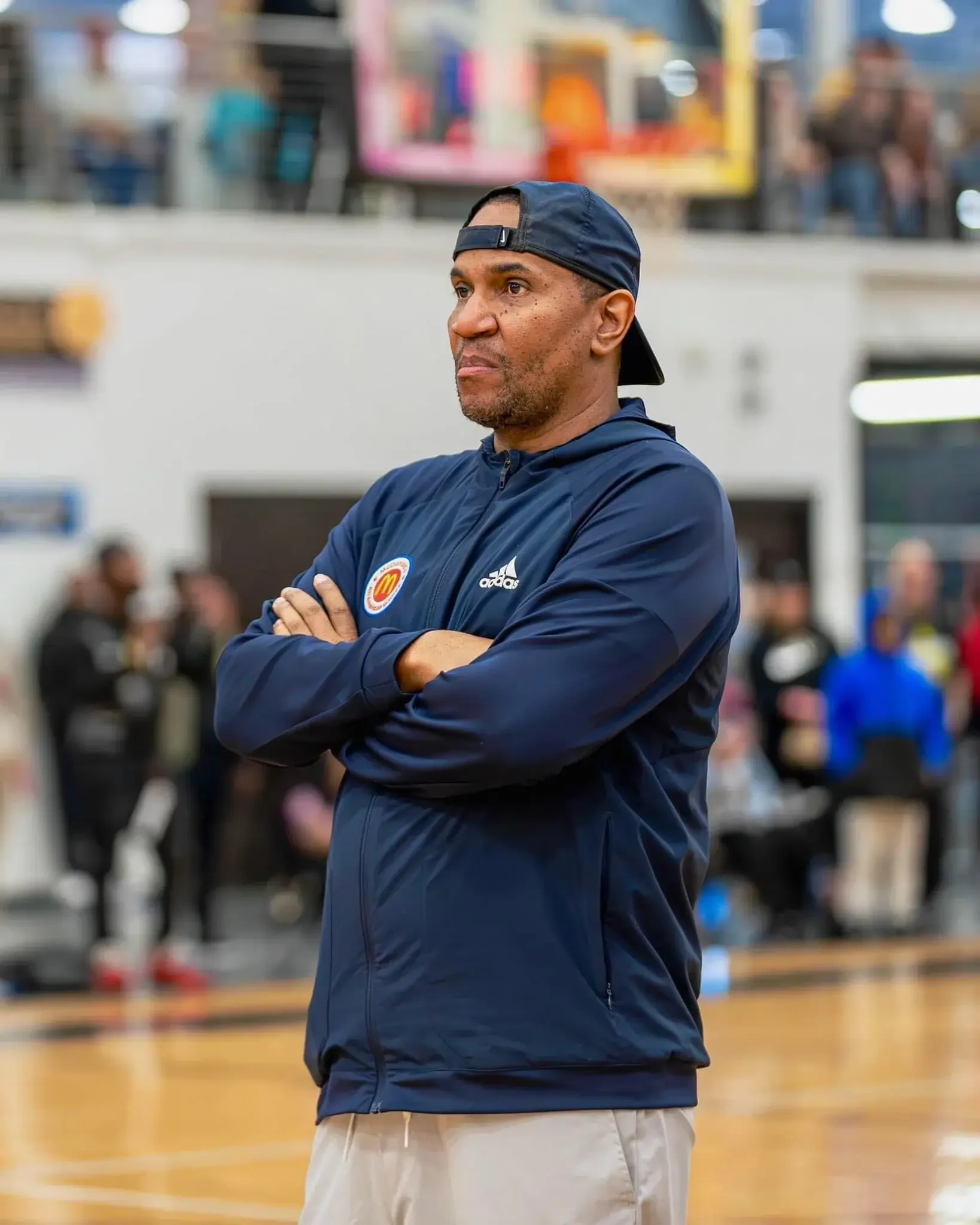 Basketball coach watching from the sideline