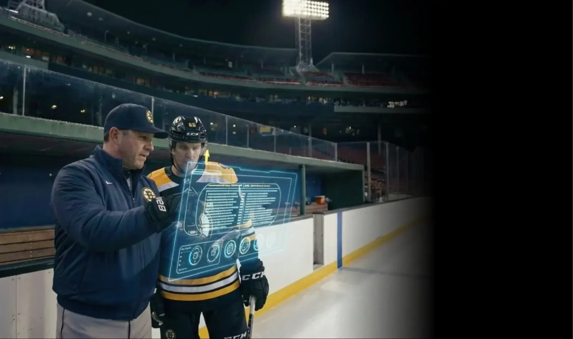 Coach and ice hockey player reviewing performance graphics