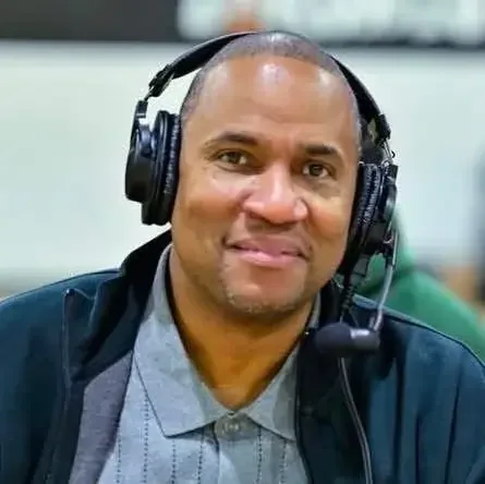 Portrait of a coach wearing headphones