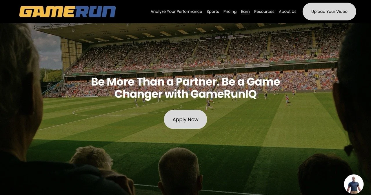 A view of a soccer stadium filled with spectators, taken from the perspective of someone sitting in the stands. The field is green with players actively engaged in a game. Overlaid text promotes GameRunIQ with a call to action to apply now.