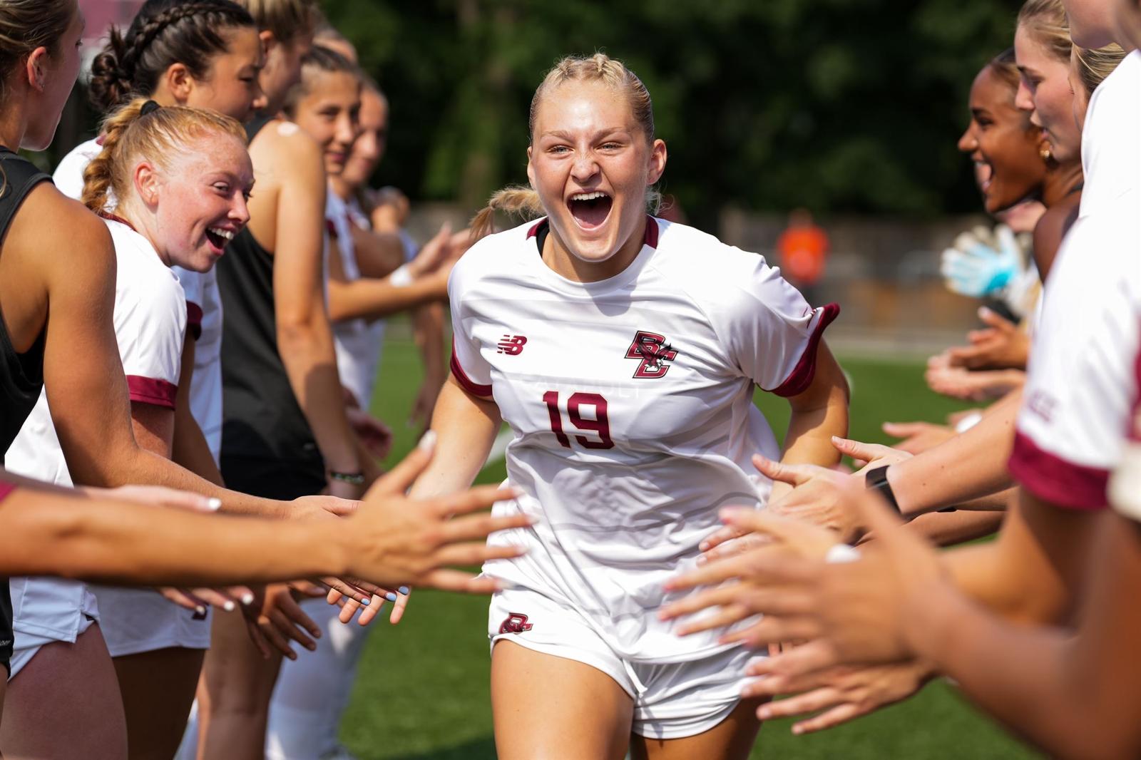 Boston College player number 19 celebrating with teammates on game day