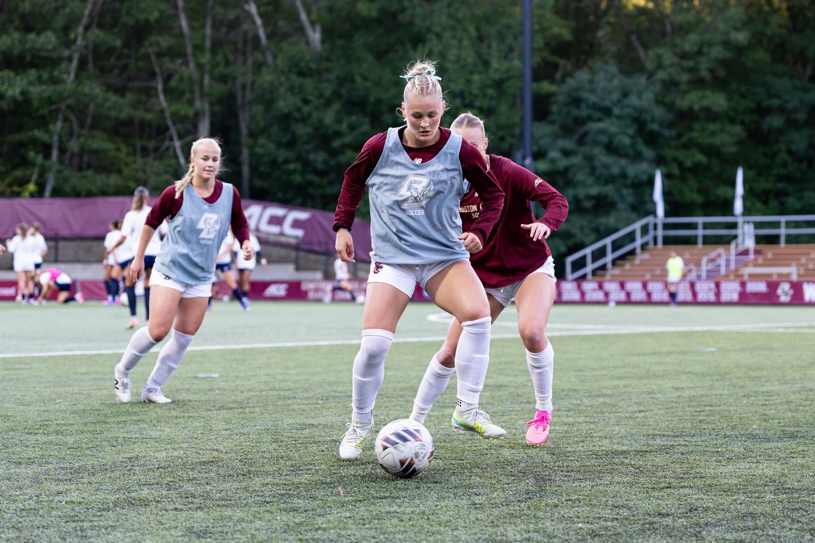 Boston College soccer players practicing ball control during training