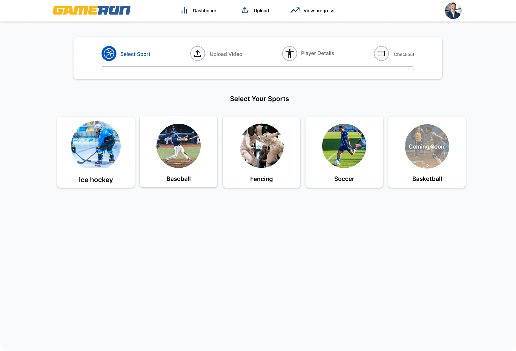 Web page titled 'GAME RUM' showing options to select sports including Ice hockey, Baseball, Fencing, Soccer, and Basketball, with a top navigation menu featuring dashboard, upload video, view progress, and user profile.