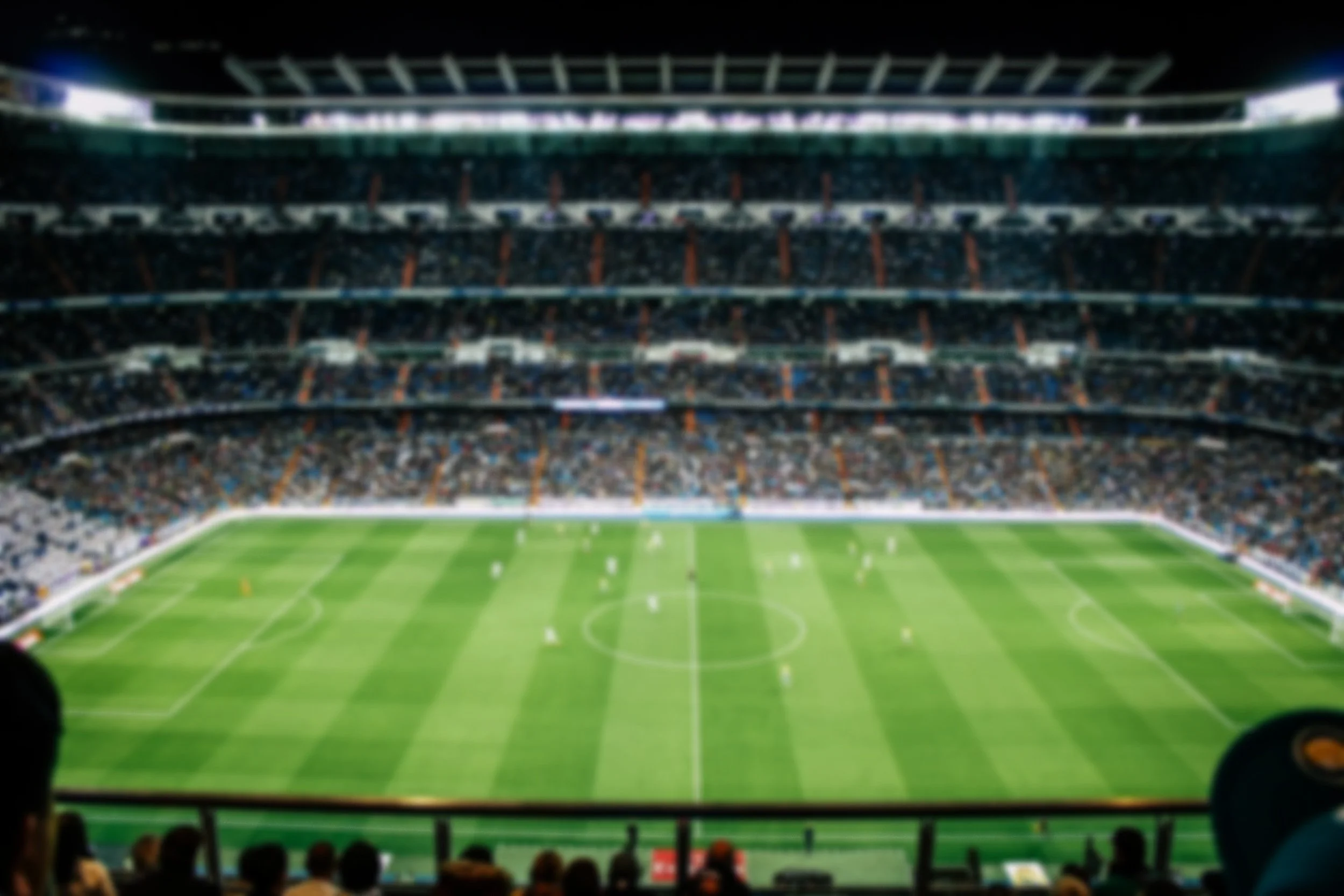 Picture of soccer game from a stadium seat position.