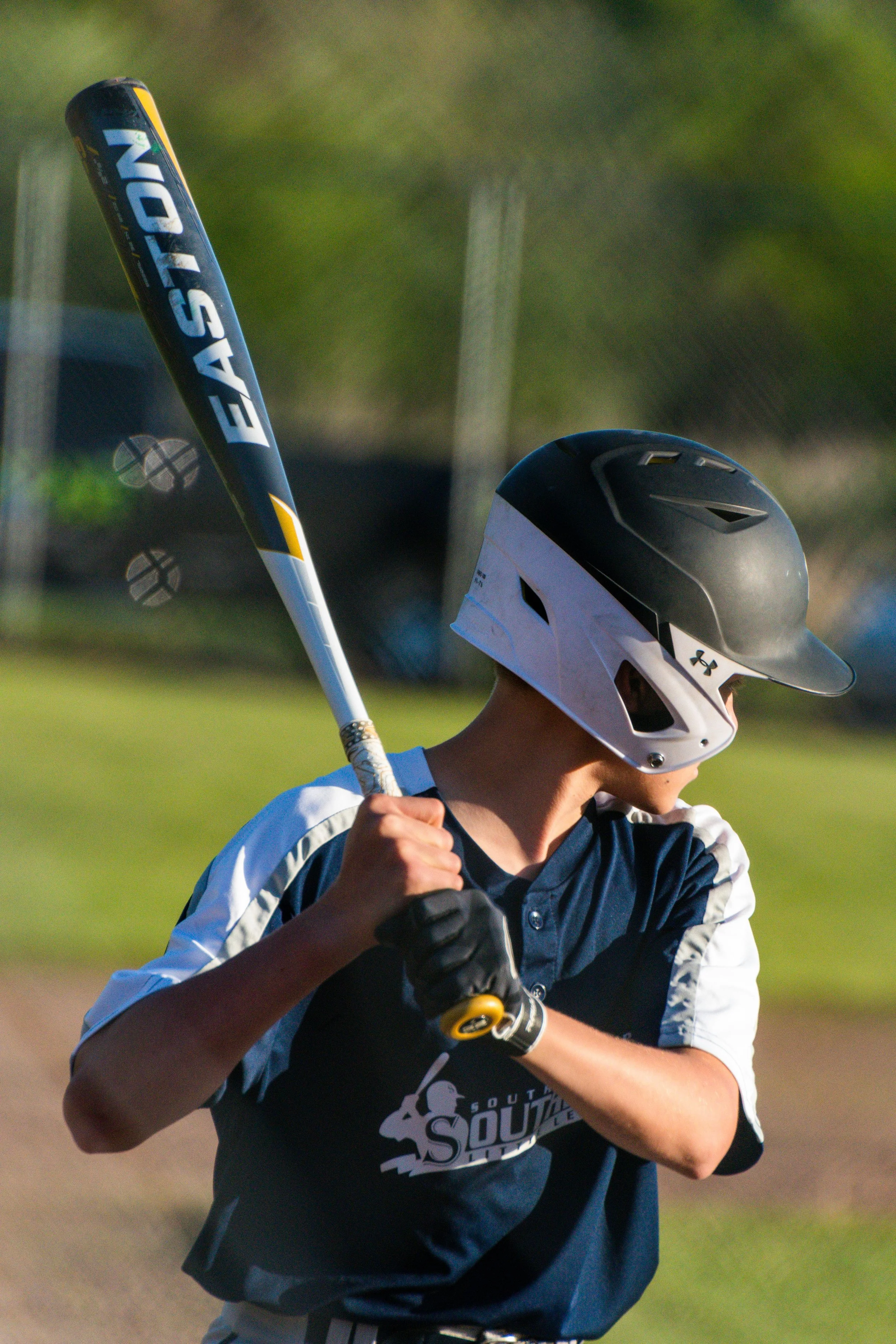 Young baseball hitter preparing to swing